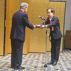 取締役の宮地計二氏が登壇